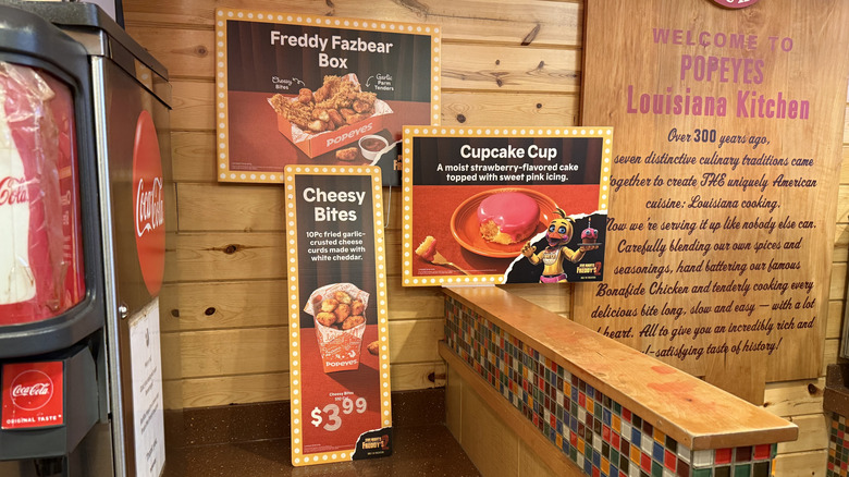 in-store ads for Popeyes' The Freddy Fazbear Crunch Menu