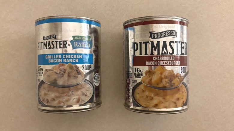 Progresso Pitmaster Grilled Chicken Bacon Ranch Soup and Progresso Pitmaster Charbroiled Bacon Cheeseburger Soup cans next to one another
