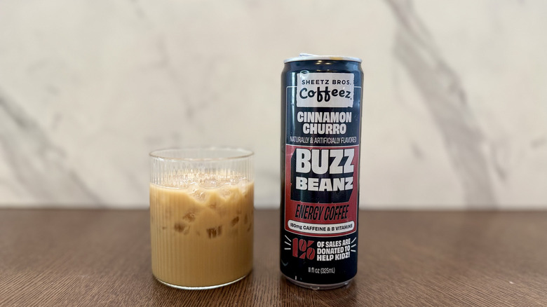 Sheetz Buzz Beanz Cinnamon Churro in a glass with the can