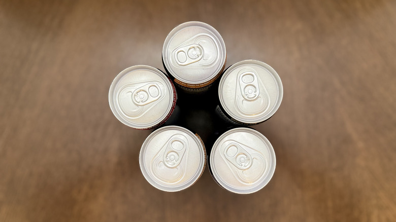 Looking down at the tops of the cans