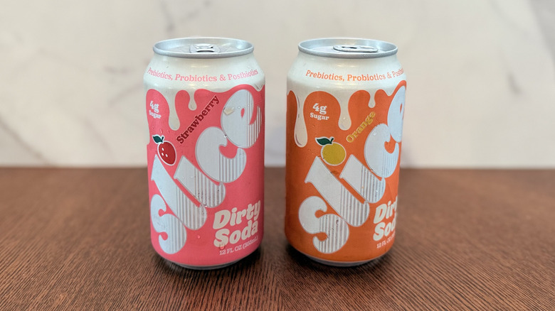 Both cans of Slice dirty soda