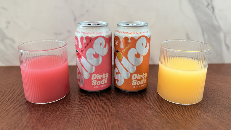 Cans of Slice soda poured into glasses