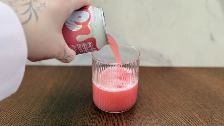 Pouring Slide strawberry dirty soda into a glass