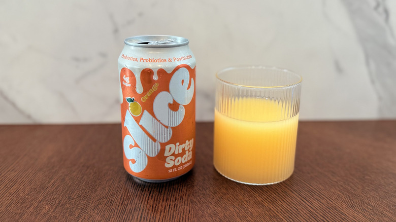 Can of Slice Orange Dirty Soda in a glass