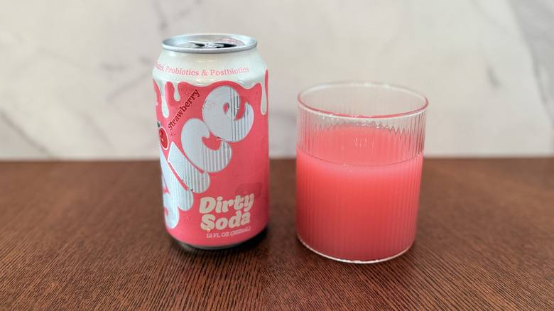 Can of Slice Strawberry Dirty Soda in a glass