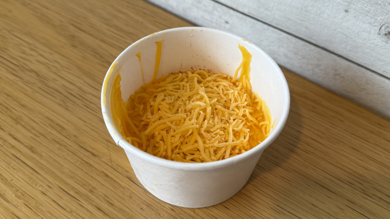 A cup of Scorchin' Cheese Sauce