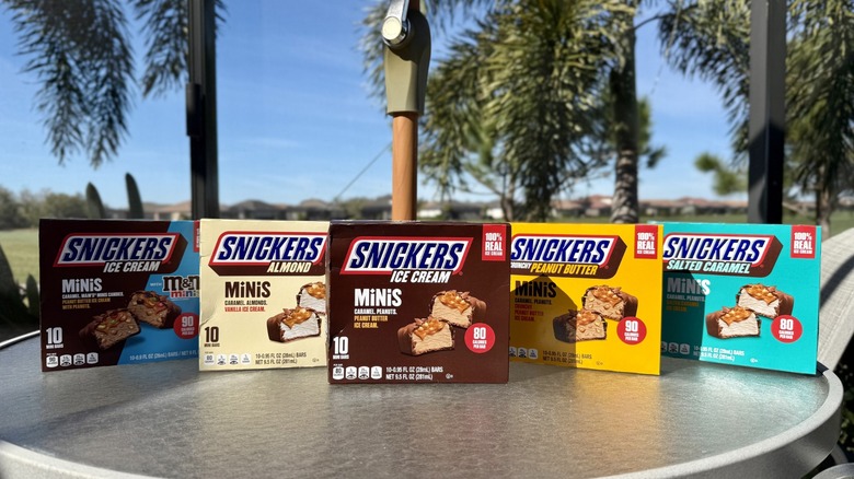 Collection of Snickers Ice Cream Minis on an outdoor table