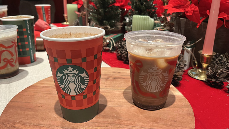 A Starbucks eggnog latte next to an iced coffee with eggnog cold foam