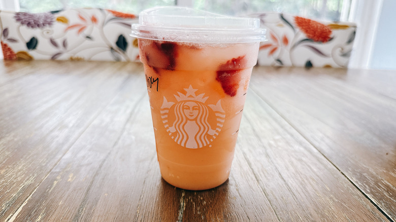 Starbucks iced mango dream on a wooden table