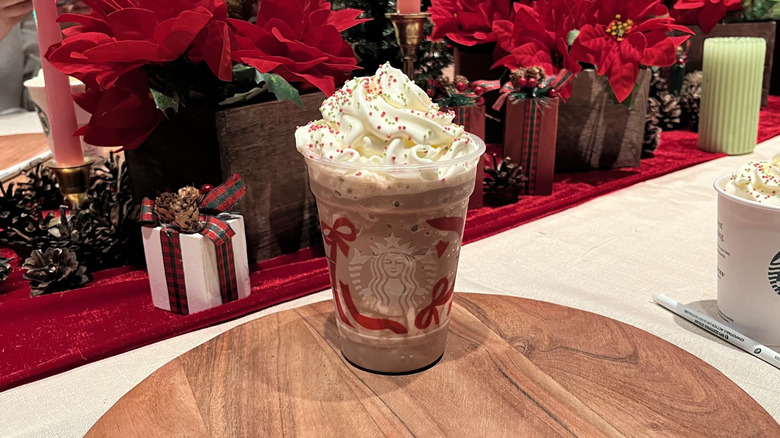A Starbucks holiday cold cup filled with frozen peppermint hot choocolate