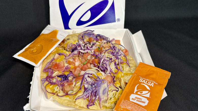 Taco Bell pizza and sauce packets in box