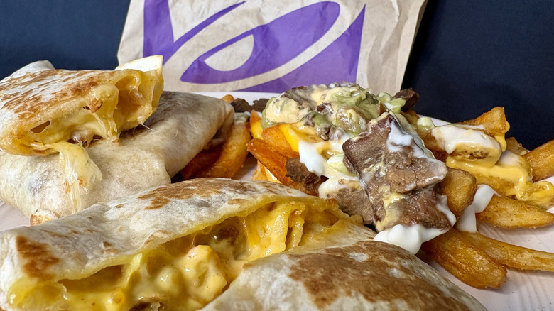 Taco Bell food on plate with logo in background