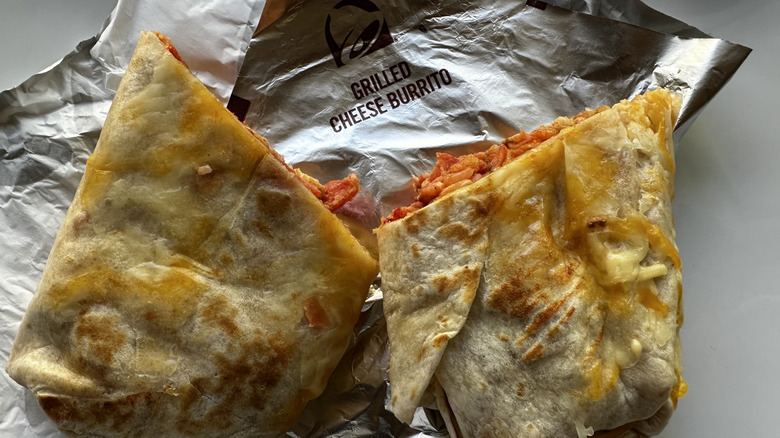 Taco Bell Flamin' Hot Grilled Cheese Burrito cut in half on wrapper