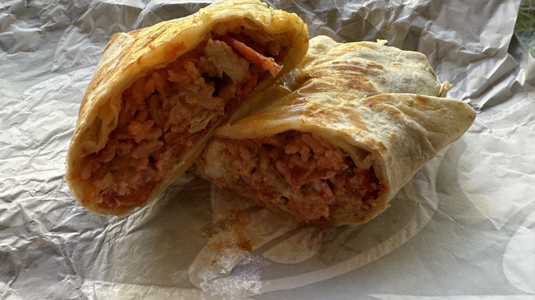 Taco Bell Flamin' Hot Grilled Cheese Burrito cut in half insides showing