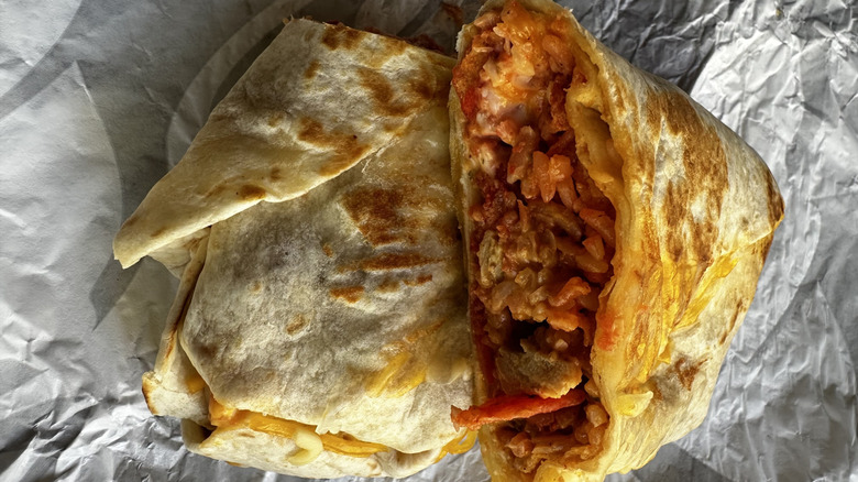 Taco Bell Flamin' Hot Grilled Cheese Burrito cut in half