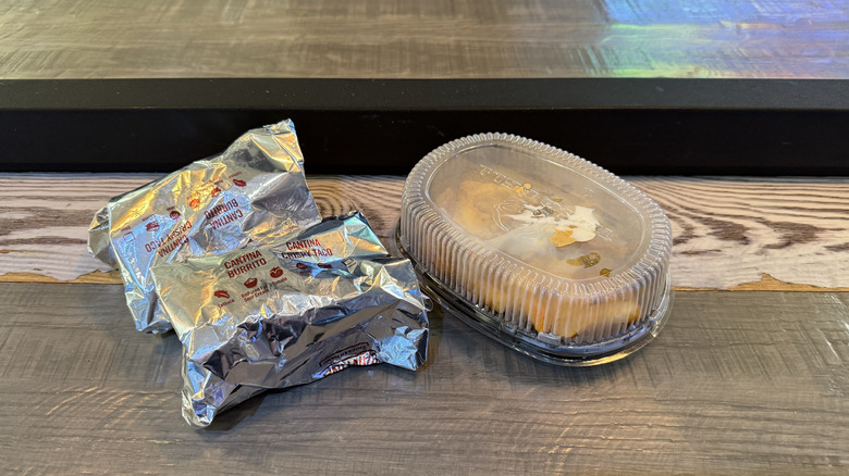 Taco Bell menu items wrapped in foil and plastic
