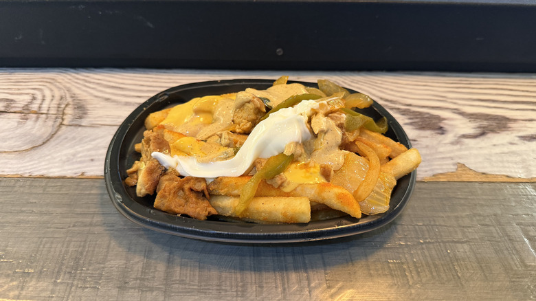 Taco Bell's Chicken Fajita Nacho Fries in a to-go container