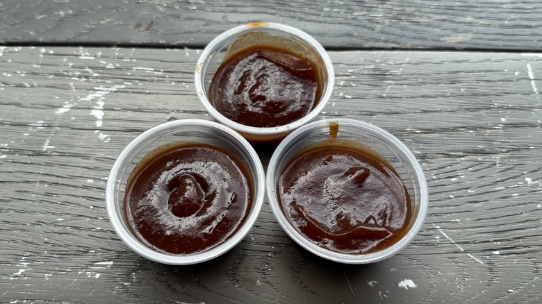 Three cups of Taco Bell's Sweet Chipotle BBQ sauce