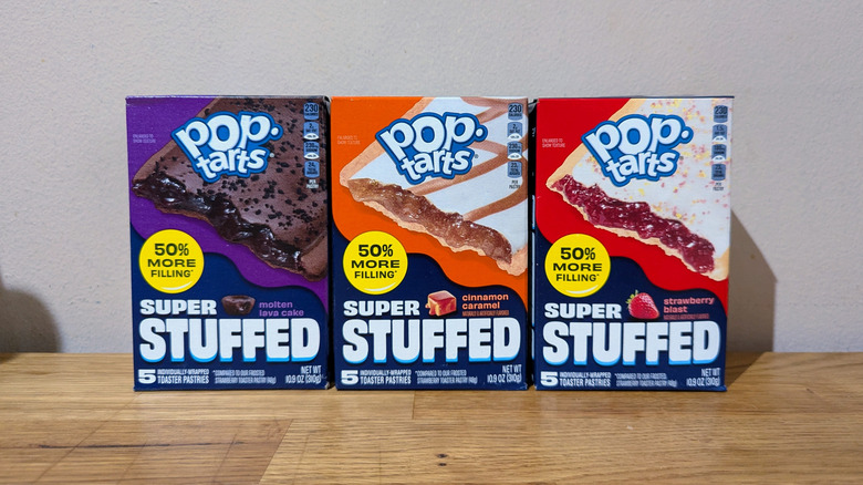 Three Pop-Tarts Super Stuffed Packages on a table.