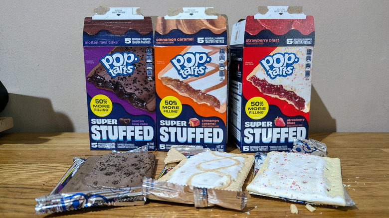 Boxes of Pop-Tarts Super Stuffed with individual pop tarts in front on a table.