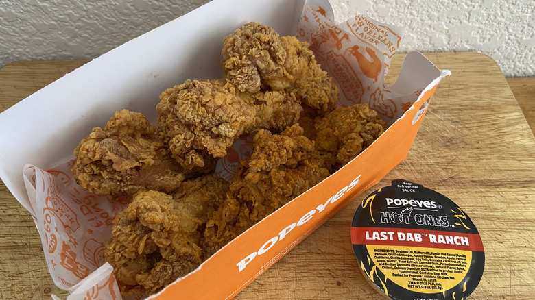 six wings in box beside Last Dab Ranch