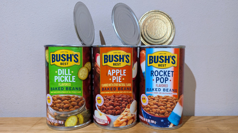 Three open limited-edition Bush's Baked bean cans on a countertop