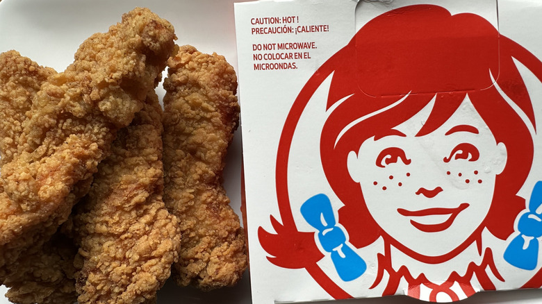 Wendy's chicken tenders next to box