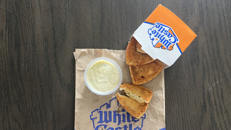 White Castle Jalapeno Cravioli with chili aioli sauce in cup.