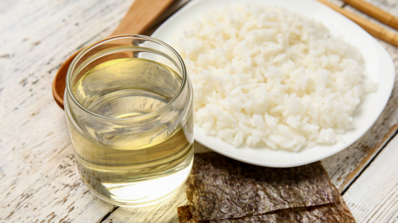 Pouring rice vinegar into a bowl