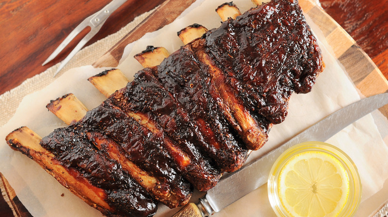 beef ribs on wooden cutting board