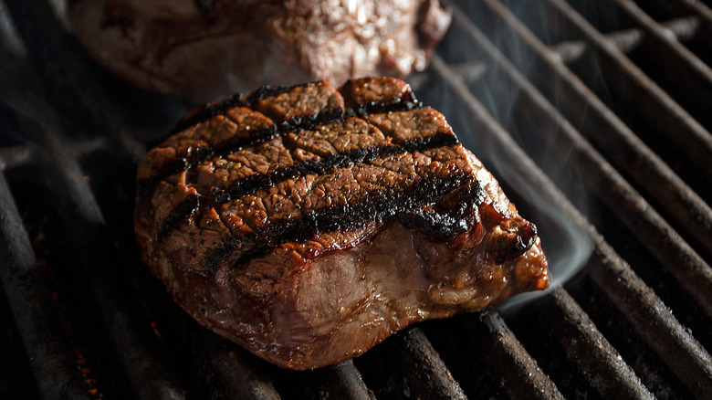 Filet mignon on grill.