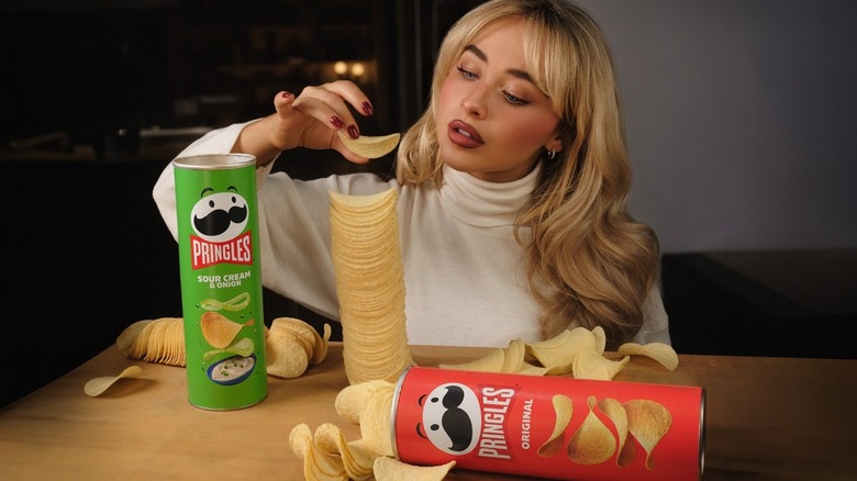 Sabrina Carpenter stacking Pringles chips