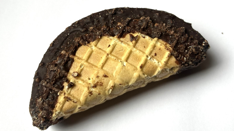 Churro Ice Cream Taco, whole, on top of its packaging on a white background.