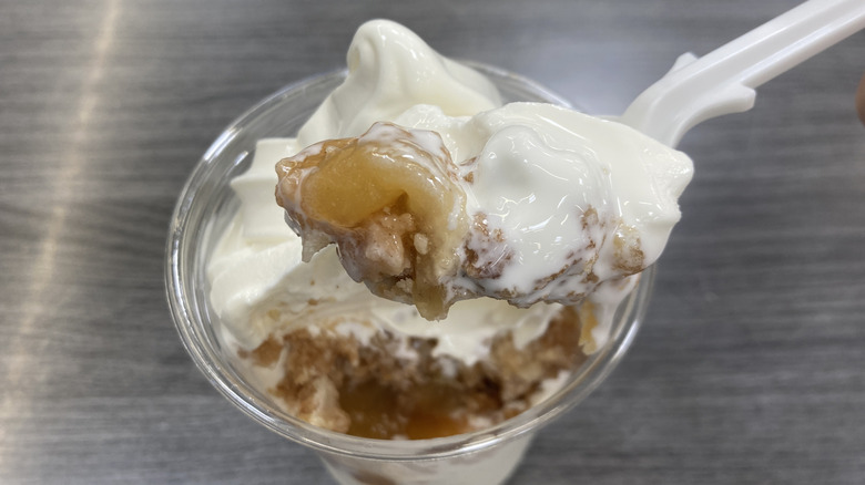 Apple pie and soft serve filling on a spoon