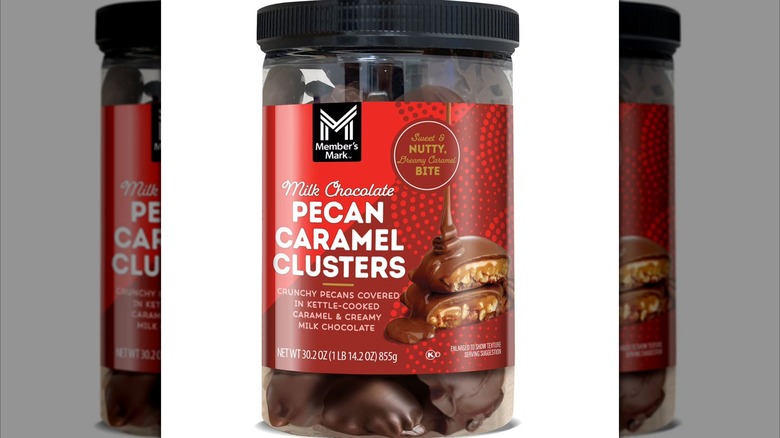 Jar of Member's Mark milk chocolate pecan caramel clusters on a white background
