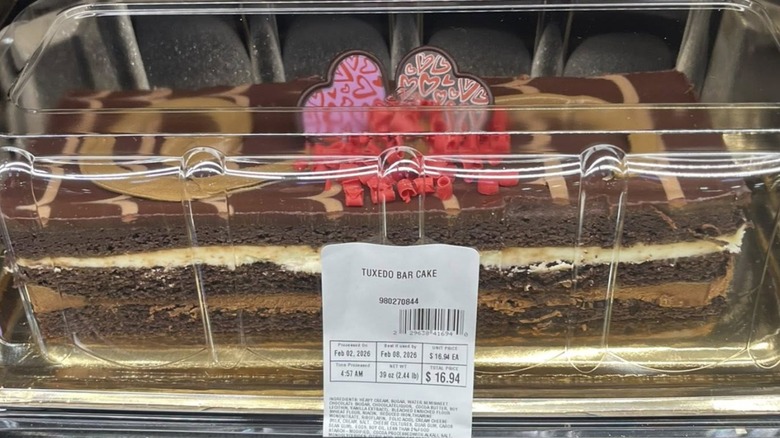 Sam's Club Tuxedo Bar Cake in a clamshell package sitting on the shelf.