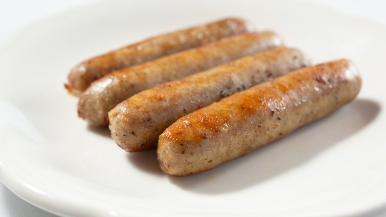 Sausage links on white plate