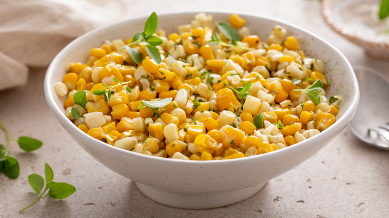 corn in bowl with fresh herbs