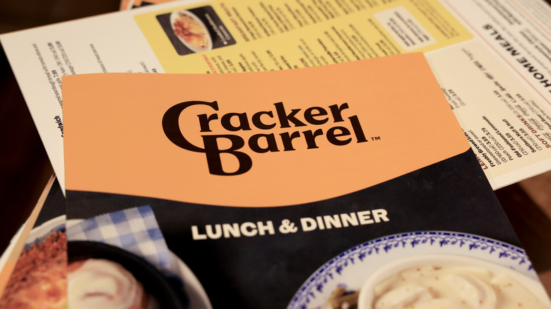 The Cracker Barrel lunch and dinner menu on top of other menus at the restaurant