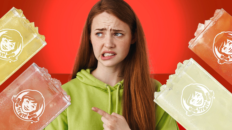 Young woman frowning, surrounded by four Wendy's lemonades