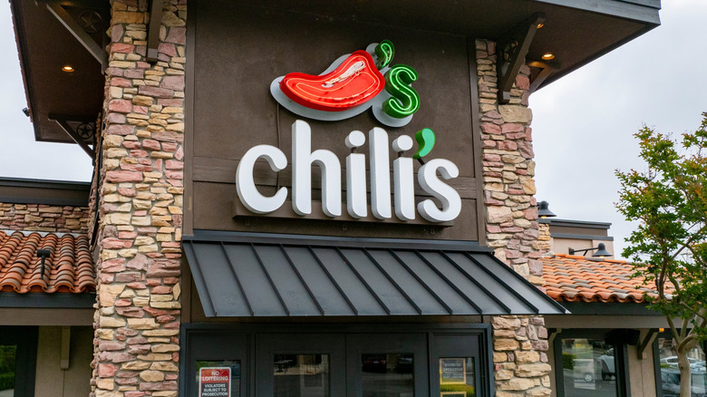 Chili's restaurant exterior entrance with neon chili pepper signage