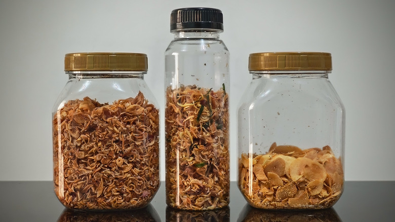 Crispy fried shallots, garlic, and scallions in glass containers