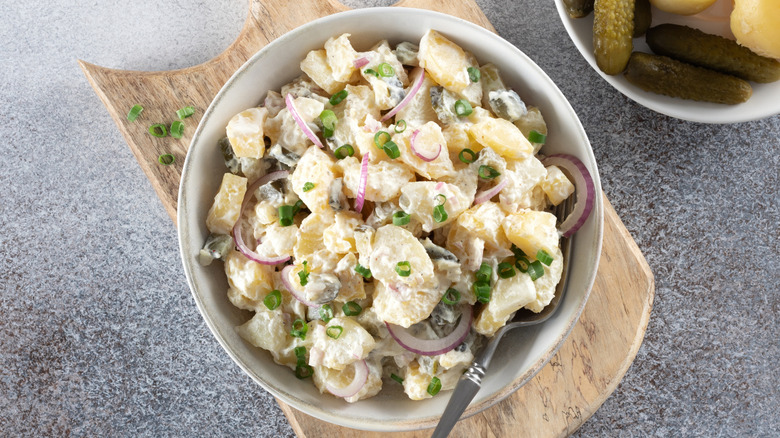 Bowl of potato salad with onions