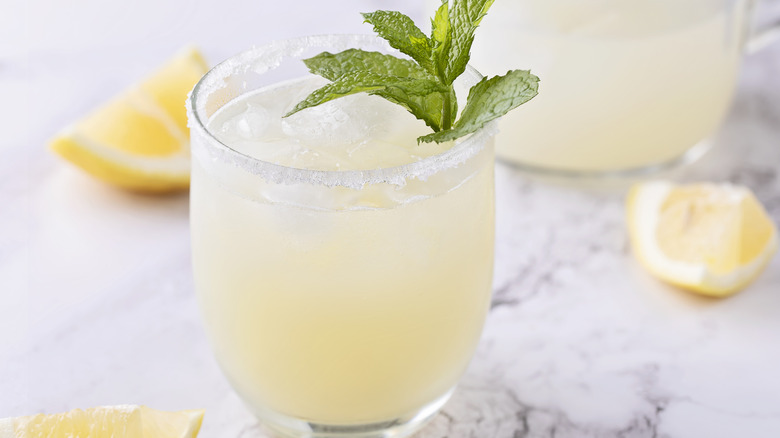Glass of lemonade with mint and sugared rim