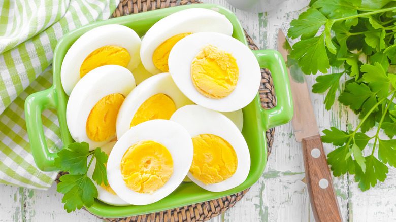 Halved boiled eggs with bright yellow yolks