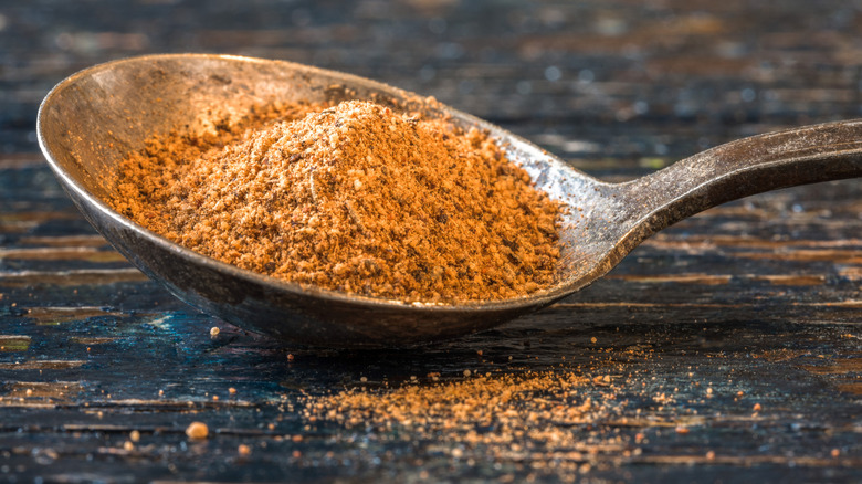 Jerk seasoning heaped on a vintage spoon.