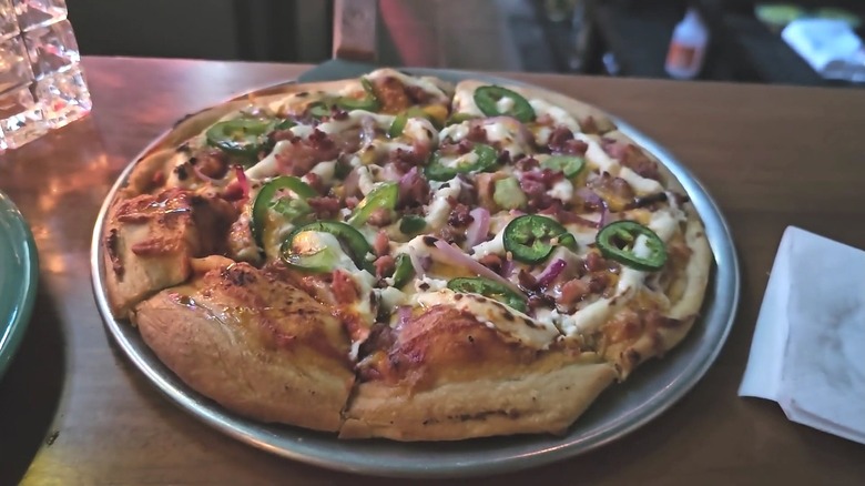 A pizza from the O'Zone Pizza Pub.
