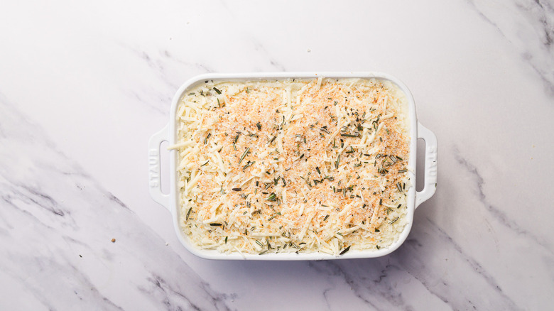 Unbaked shepherd's pie with aged cheddar and rosemary potato topping