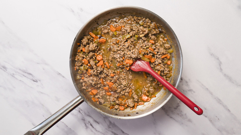 Cooked lamb filling in pan