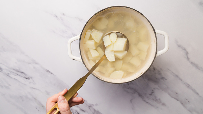 Boiled potatoes in pot